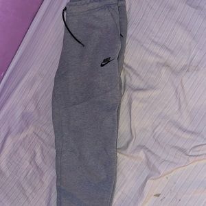 Grey Nike tech with small rip